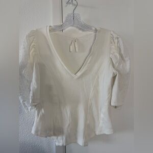 So feminine and pretty! Anthropologie Cream V-Neck Puff Sleeve Top